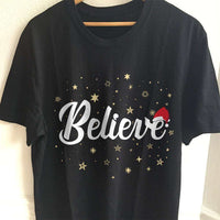 Load image into Gallery viewer, Designs by MyUtopia Shout Out:Believe Stars and Santa Hat Adult Unisex T-Shirt
