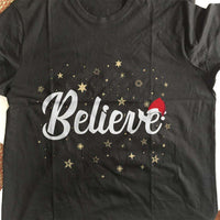 Load image into Gallery viewer, Designs by MyUtopia Shout Out:Believe Stars and Santa Hat Adult Unisex T-Shirt
