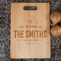 Load image into Gallery viewer, Designs by MyUtopia Shout Out:Cooking up A Storm Personalized with Family Name and Year Cutting Board
