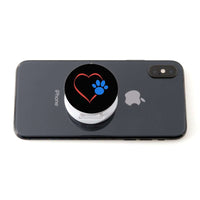 Load image into Gallery viewer, Designs by MyUtopia Shout Out:Heart w Blue Dog Paw (on Black) Hinged Phone Grip and Stand for Smartphones and Tablets
