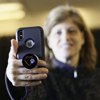 Load image into Gallery viewer, Designs by MyUtopia Shout Out:Heart w Blue Dog Paw (on Black) Hinged Phone Grip and Stand for Smartphones and Tablets
