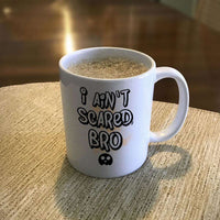 Load image into Gallery viewer, Designs by MyUtopia Shout Out:I Ain&#39;t Scared Bro White Ceramic Coffee Mug
