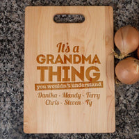 Load image into Gallery viewer, Designs by MyUtopia Shout Out:It&#39;s A Grandma Thing Personalized with Kids Names Engraved Maple Cutting Board
