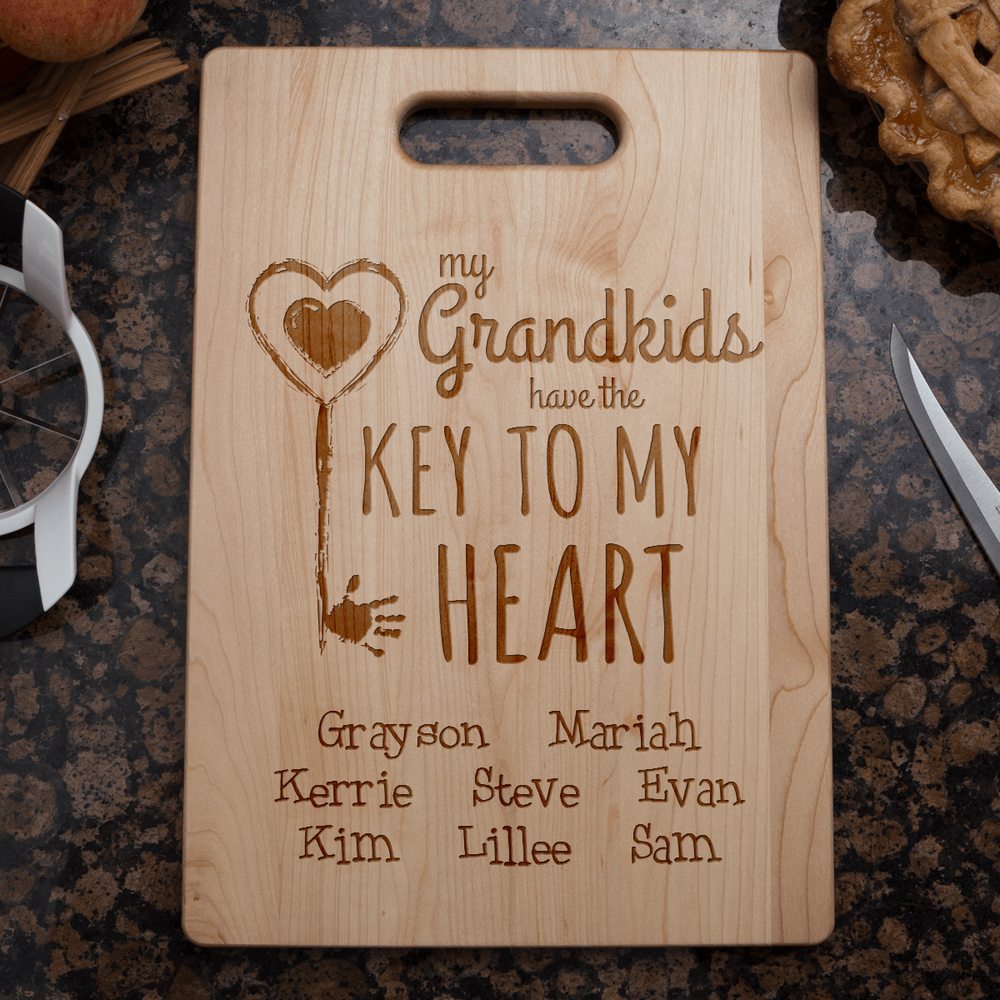 Designs by MyUtopia Shout Out:Key To Grandma's Heart Engraved Cutting Board Personalized Gift