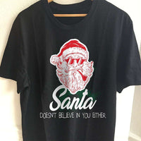 Load image into Gallery viewer, Designs by MyUtopia Shout Out:Santa Doesn&#39;t Believe In You Either Adult Unisex T-Shirt
